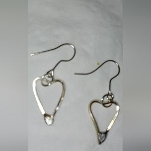 A pair of NEW small heart earrings never worn.